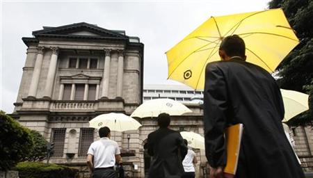 People walk towards the Bank of Japan building in Tokyo People walk towards the Bank of Japan building in Tokyo