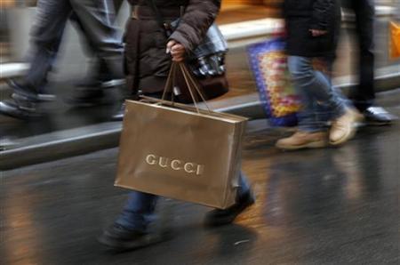 Shoppers stroll along Condotti street during the Christmas season in downtown Rome Shoppers stroll along Condotti street during the Christmas season in downtown Rome