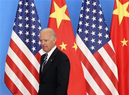 U.S. Vice-President Biden arrives with his Chinese counterpart Xi at a China-US Business Dialogue in the Beijing Hotel in Beijing U.S. Vice-President Biden arrives with his Chinese counterpart Xi at a China-US Business Dialogue in the Beijing Hotel in Beijing