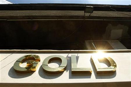 The logo of a gold jewellery shop is seen in Bucharest The logo of a gold jewellery shop is seen in Bucharest