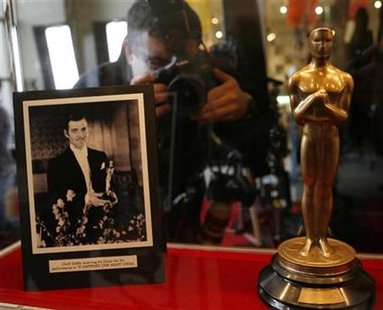 A photographer takes a picture of the 1934 Oscar awarded to Clark Gable for "It Happened One Night" at the "Meet the Oscars, Chicago" event A photographer takes a picture of the 1934 Oscar awarded to Clark Gable for "It Happened One Night" at the "Meet the Oscars, Chicago" event
