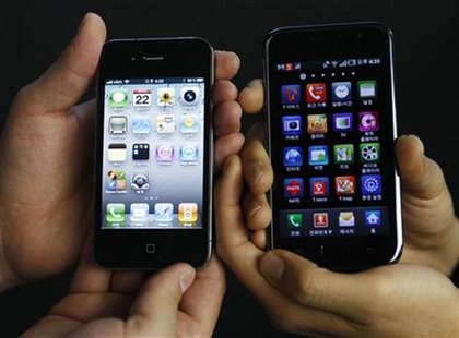 An Apple Inc's iPhone 4 smartphone and a Samsung Electronics' Galaxy S smartphone are seen in this picture illustration taken in Seoul An Apple Inc's iPhone 4 smartphone and a Samsung Electronics' Galaxy S smartphone are seen in this picture illustration taken in Seoul