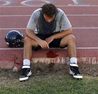 McClintock High School Chargers football player Joe Sanford takes a break from practice after feeling light-headed in Tempe McClintock High School Chargers football player Joe Sanford takes a break from practice after feeling light-headed in Tempe