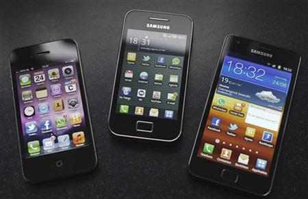 A Samsung S II and Samsung Ace smartphones are seen next to an Apple iPhone 4 in Houten A Samsung S II and Samsung Ace smartphones are seen next to an Apple iPhone 4 in Houten