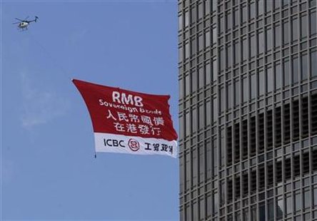 A helicopter carries an ICBC advertisement banner promoting RMB sovereign bonds in Hong Kong A helicopter carries an ICBC advertisement banner promoting RMB sovereign bonds in Hong Kong