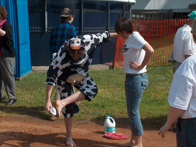 Lee Peek and Nikki Montgomery walk through cow pies for St Jude at the Marathon County June Dairy Breakfast 2005