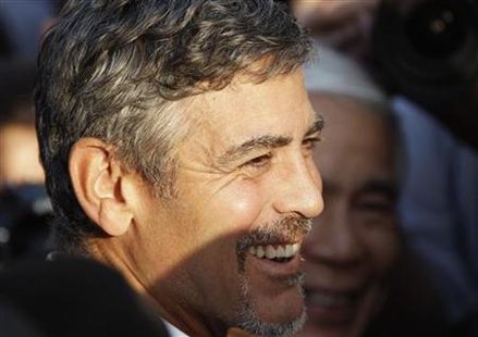 U.S. actor George Clooney smiles after South Sudan's President Salva Kiir cast his ballot at a polling station in Juba U.S. actor George Clooney smiles after South Sudan's President Salva Kiir cast his ballot at a polling station in Juba