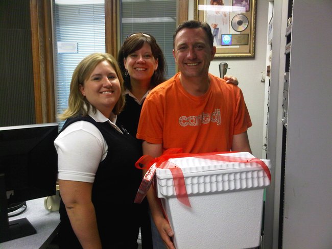 Lee Peek with the ladies from Trigs. They brought him a goodbye/thank you gift on his last day 8/26/11