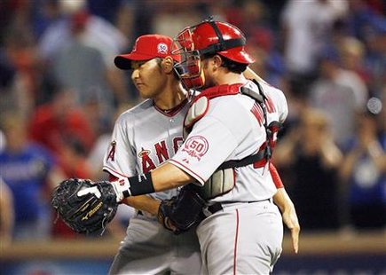Angels relief pitcher Takahashi and catcher Wilson celebrate after beating the Rangers in Arlington, Texas Angels relief pitcher Takahashi and catcher Wilson celebrate after beating the Rangers in Arlington, Texas