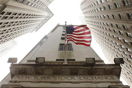 The United States flag hangs outside the New York Stock Exchange The United States flag hangs outside the New York Stock Exchange
