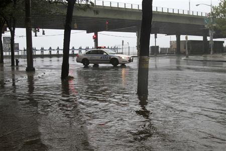 A police car sits surrounded by water in lower Manahattan as Hurricane Irene closes in on the New York City A police car sits surrounded by water in lower Manahattan as Hurricane Irene closes in on the New York City