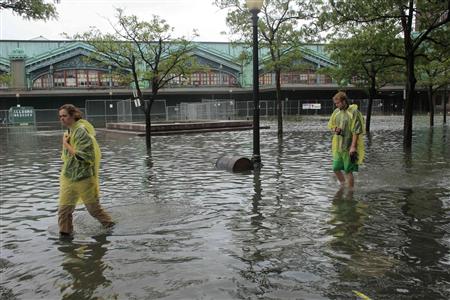 People walk through flooded streets after the pass of Hurricane Irene at Hoboken People walk through flooded streets after the pass of Hurricane Irene at Hoboken