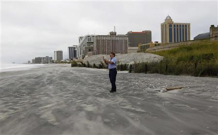 A worker at the Trump Casino in Atlantic City takes a picture of the coastline near the boardwalk following Hurricane Irene A worker at the Trump Casino in Atlantic City takes a picture of the coastline near the boardwalk following Hurricane Irene