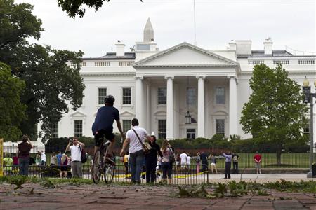 Tourists walk by the White House the morning after Hurricane Irene passed by Washington Tourists walk by the White House the morning after Hurricane Irene passed by Washington