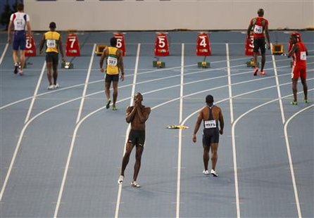 Usain Bolt of Jamaica reacts after being disqualified for a false start in the men's 100 metres final at the IAAF 2011 World Championship in Usain Bolt of Jamaica reacts after being disqualified for a false start in the men's 100 metres final at the IAAF 2011 World Championship in