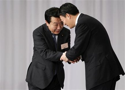 Japan's Finance Minister Yoshihiko Noda, who was chosen as the new leader of the ruling Democratic Party of Japan, shakes hands with Trade M Japan's Finance Minister Yoshihiko Noda, who was chosen as the new leader of the ruling Democratic Party of Japan, shakes hands with Trade M
