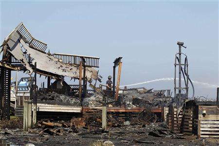 Firefighters put out flames at a rental house after it was destroyed by Hurricane Irene at Cape Hatteras National Seashore in Rodanthe Firefighters put out flames at a rental house after it was destroyed by Hurricane Irene at Cape Hatteras National Seashore in Rodanthe