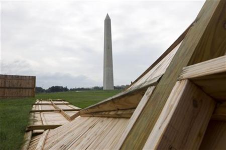 A fallen wooden state park fences is seen on the ground near the Washington Monument A fallen wooden state park fences is seen on the ground near the Washington Monument