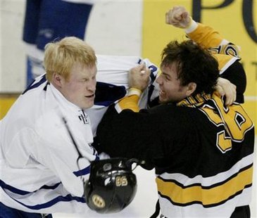 Wade Belak knocks helmet off Bruins' Doug Doull. Wade Belak knocks helmet off Bruins' Doug Doull.