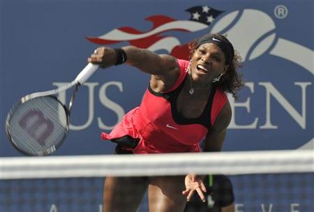 Serena Williams of the U.S. hits a serve to Michaella Kajicek of the Netherlands during their match at the U.S. Open tennis tournament in Ne Serena Williams of the U.S. hits a serve to Michaella Kajicek of the Netherlands during their match at the U.S. Open tennis tournament in Ne