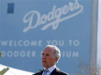 Los Angeles Dodgers owner Frank McCourt listens at a news conference about increased security at Dodger Stadium in Los Angeles Los Angeles Dodgers owner Frank McCourt listens at a news conference about increased security at Dodger Stadium in Los Angeles