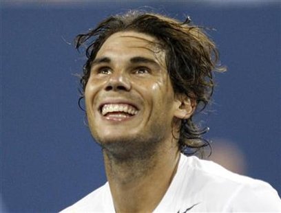 Rafael Nadal of Spain looks up at the crowd as he celebrates defeating Andrey Golubev of Kazakhstan Rafael Nadal of Spain looks up at the crowd as he celebrates defeating Andrey Golubev of Kazakhstan