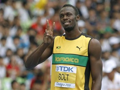 Usain Bolt of Jamaica gestures before the start of his men's 200 metres heat at the IAAF World Championships in Daegu