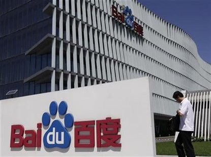 An employee walks past the Baidu company signage outside its headquarters in Beijing An employee walks past the Baidu company signage outside its headquarters in Beijing