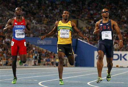 Edward of Panama Forsythe of Jamaica and Dix of the U.S. react after their men's 200 metres semi-final heat at the IAAF World Championships 