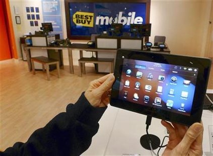 A customer holds a Research In Motion's PlayBook tablet computer in Fairfax A customer holds a Research In Motion's PlayBook tablet computer in Fairfax