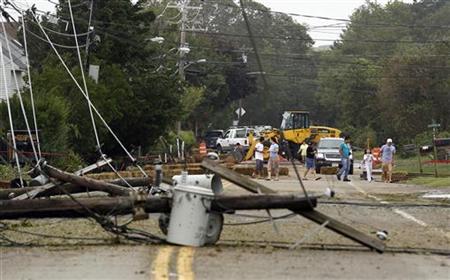 Residents inspect fallen power lines in Hampton Bays, New York Residents inspect fallen power lines in Hampton Bays, New York
