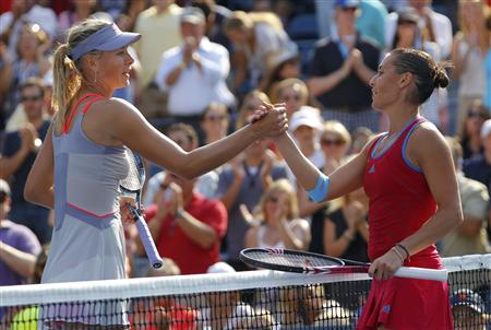 Flavia Pennetta of Italy celebrates after defeating Maria Sharapova of Russia during their match at the U.S. Open tennis tournament in New Y Flavia Pennetta of Italy celebrates after defeating Maria Sharapova of Russia during their match at the U.S. Open tennis tournament in New Y