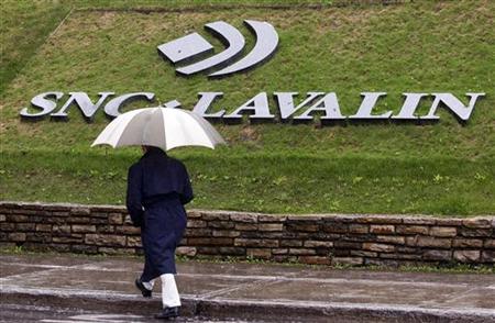A pedestrian walks past the SNC-Lavalin Group Inc., headquarters in Montreal A pedestrian walks past the SNC-Lavalin Group Inc., headquarters in Montreal