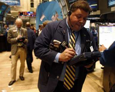 A specialist trader works on the floor of the New York Stock Exchange in New York August 12, 2011. REUTERS/Jessica Rinaldi A specialist trader works on the floor of the New York Stock Exchange in New York August 12, 2011. REUTERS/Jessica Rinaldi