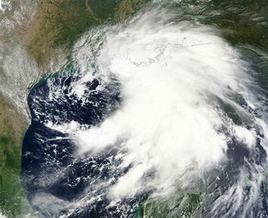 A satellite image shows Tropical Storm Lee extending from the Yucatan Peninsula across the Gulf of Mexico and over southern Louisiana, Missi