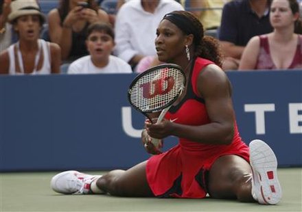 Serena Williams of the U.S. does the splits after making a shot against Victoria Azarenka of Belarus during their match at the U.S. Open ten Serena Williams of the U.S. does the splits after making a shot against Victoria Azarenka of Belarus during their match at the U.S. Open ten