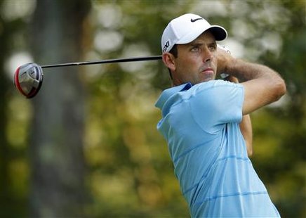 Charl Schwartzel of South Africa tees off from on the ninth hole during the second round of the Deutsche Bank Championship golf tournament i Charl Schwartzel of South Africa tees off from on the ninth hole during the second round of the Deutsche Bank Championship golf tournament i