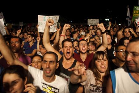 Israelis take part in a demonstration calling for lower living costs and social justice in Tel Aviv Israelis take part in a demonstration calling for lower living costs and social justice in Tel Aviv