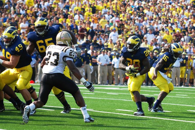Shots from the Western Michigan-Michigan game, Sept 3, 2011. The game was called short after 3 quarters due to storms, giving Michigan a 34-10 win. Photos by Sean Patrick Duross.