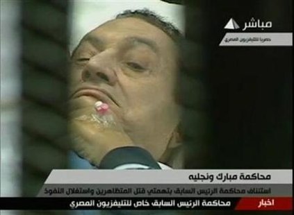 Former Egyptian President Hosni Mubarak is seen in the courtroom during his trial at the police academy in Cairo in this still image taken f Former Egyptian President Hosni Mubarak is seen in the courtroom during his trial at the police academy in Cairo in this still image taken f
