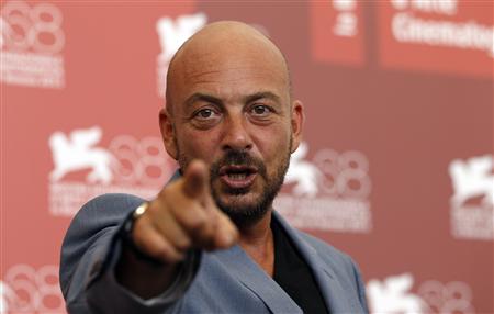Director Emanuele Crialese points as he poses during a photocall for his film "Terraferma" at the 68th Venice Film Festival Director Emanuele Crialese points as he poses during a photocall for his film "Terraferma" at the 68th Venice Film Festival