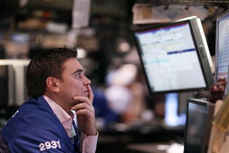 A trader works on the floor of the New York Stock Exchange A trader works on the floor of the New York Stock Exchange