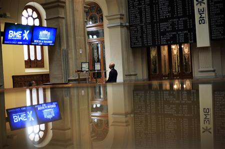A trader looks at a computer screen at Madrid's bourse A trader looks at a computer screen at Madrid's bourse
