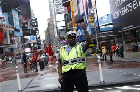 A police officer gestures as he works in New York's Times Square A police officer gestures as he works in New York's Times Square