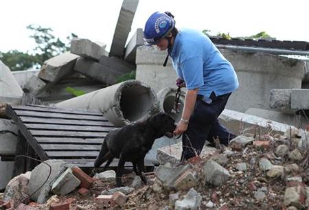 Red, a 12-year-old Labrador who is retired as an active search dog, is rewarded by her handler in Pumphrey Red, a 12-year-old Labrador who is retired as an active search dog, is rewarded by her handler in Pumphrey