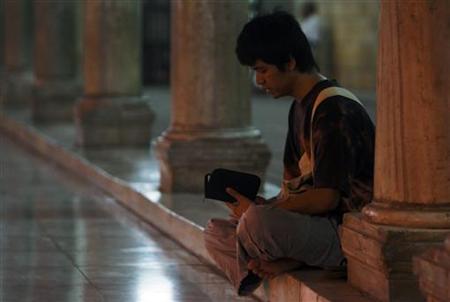 A Muslim man reads the Koran at the Al Azhar mosque in Cairo A Muslim man reads the Koran at the Al Azhar mosque in Cairo
