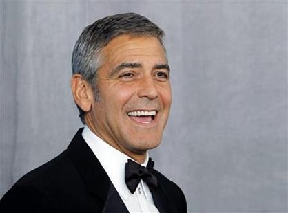Actor Clooney poses backstage after receiving the Bob Hope Humanitarian Award at the 62nd annual Primetime Emmy Awards in Los Angeles Actor Clooney poses backstage after receiving the Bob Hope Humanitarian Award at the 62nd annual Primetime Emmy Awards in Los Angeles