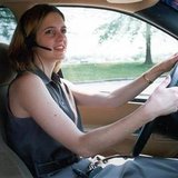 An unidentified woman uses a "hands-free" headset to make her driving easier and safer. Proposals to..