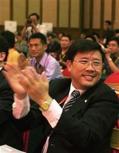 Liang Wengen, chairman and main shareholder of Sany Group, claps during a meeting in Changsha Liang Wengen, chairman and main shareholder of Sany Group, claps during a meeting in Changsha