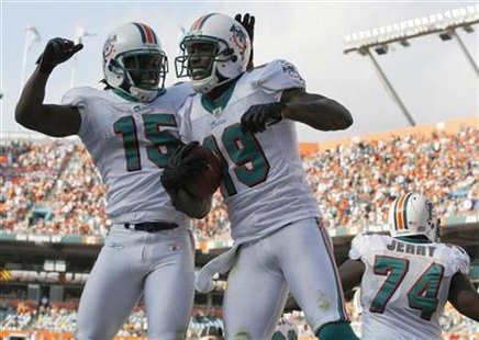 Miami Dolphins Davone Bess celebrates with teammate Brandon Marshall after Marshall scored a touchdown against the Buffalo Bills during four Miami Dolphins Davone Bess celebrates with teammate Brandon Marshall after Marshall scored a touchdown against the Buffalo Bills during four